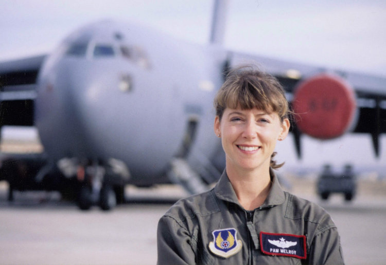 Pamela Melroy smiling onsite in her job. This photo was taken when Pam Graduated as a US Air Force test pilot in 1991