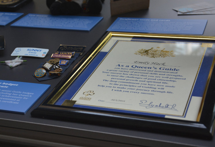 Queen's guide certificate and badges
